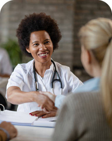 Doctor shaking hands with patient.