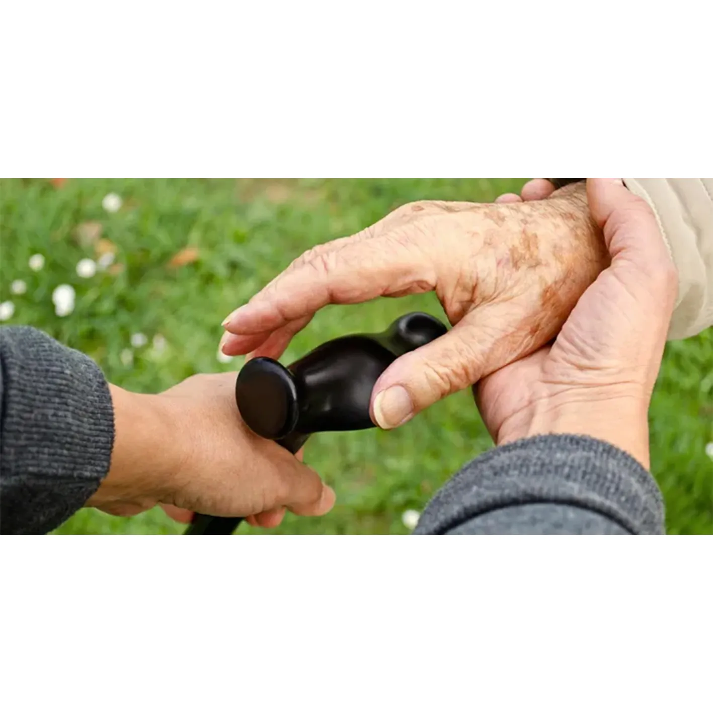 Helping hands with a walking cane.