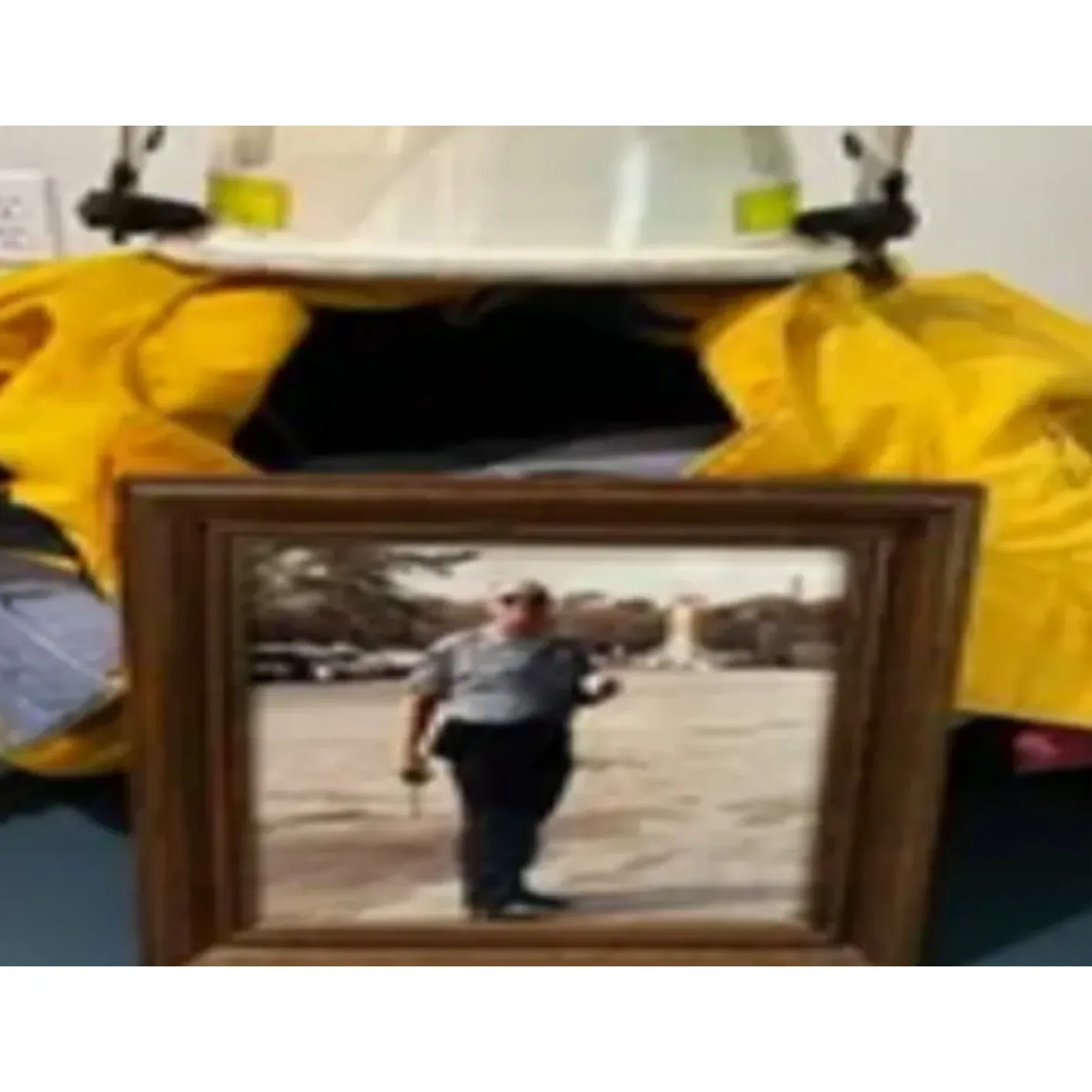 Framed photo of firefighter in uniform.