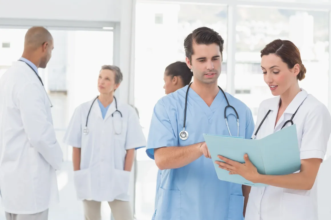 Doctors reviewing patient charts together.