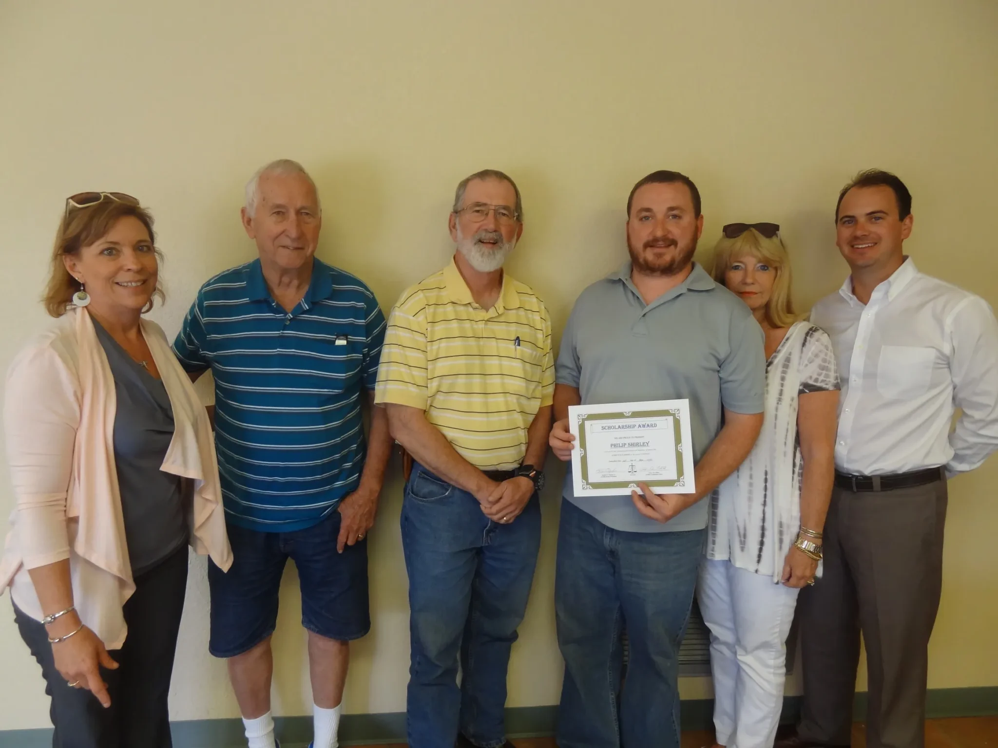 Scholarship award recipient with family.